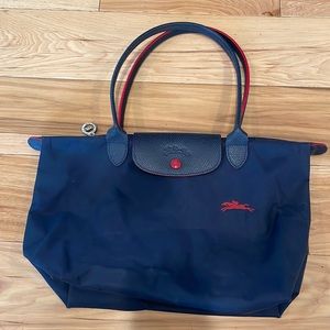 15” wide X 9” high. Navy blue with red accents.